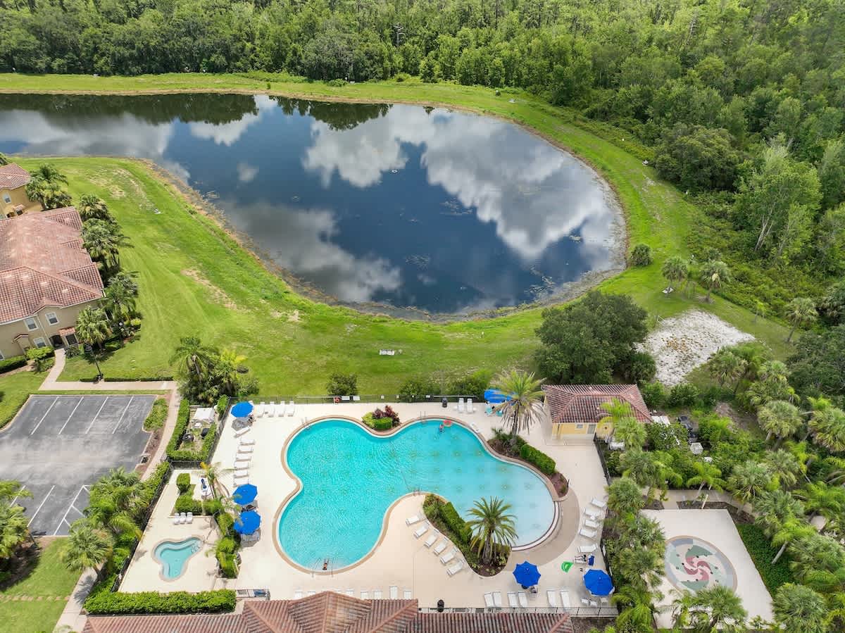 3BR Home 1.5 mi to Disney | Lagoon Pool, Spa & Gym - Image 1